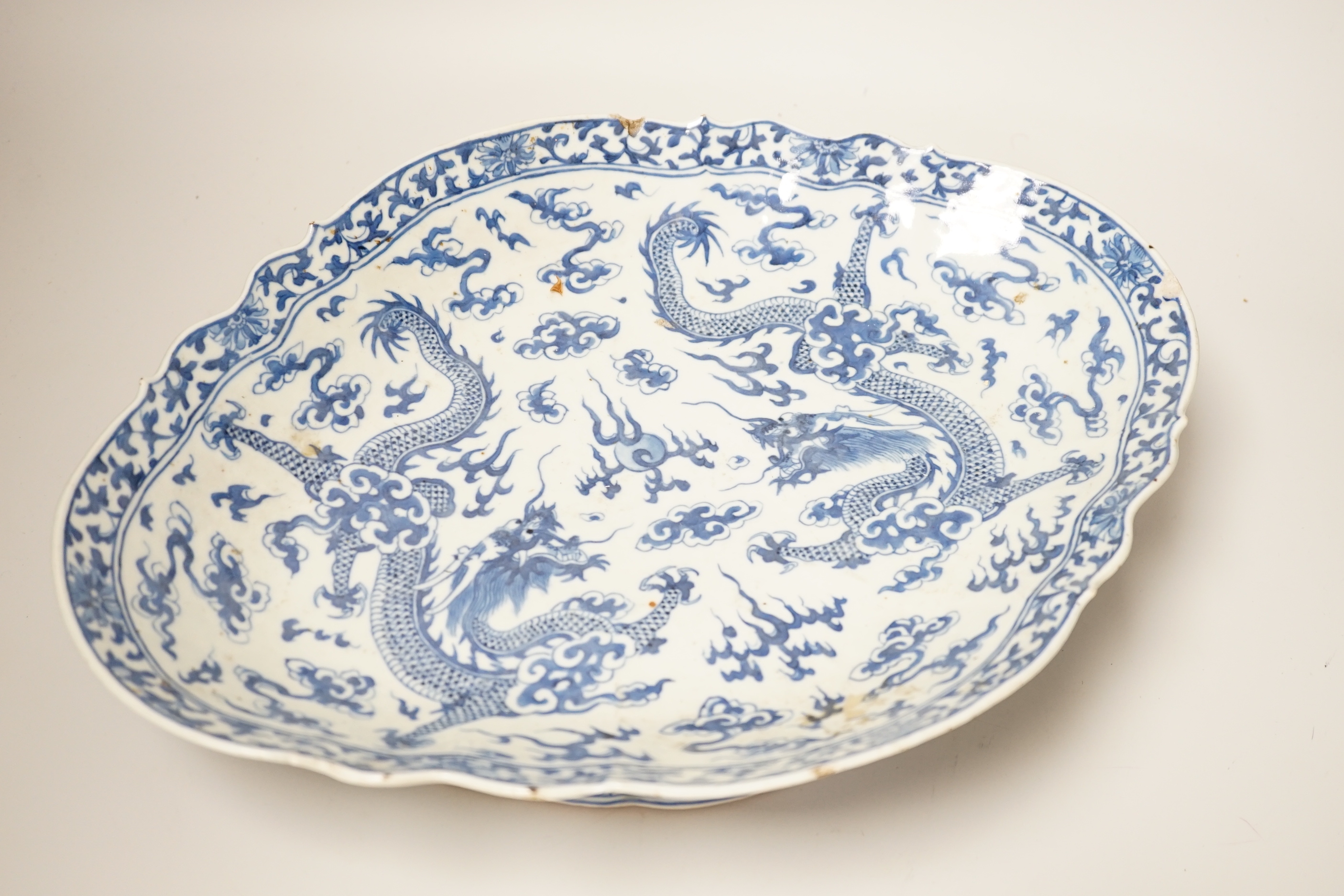 A 19th century Chinese blue and white ‘dragon’ lozenge shaped dish, 39cm